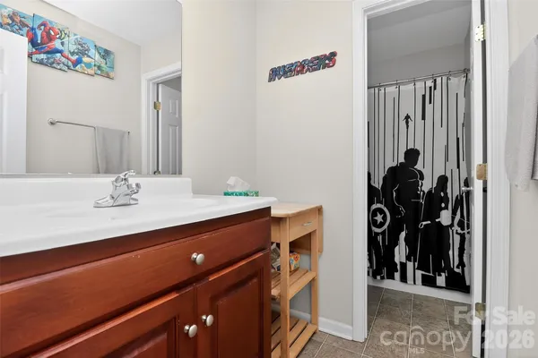 a view of bedroom with furniture and window
