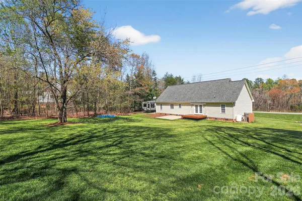 a backyard of a house with lots of green space