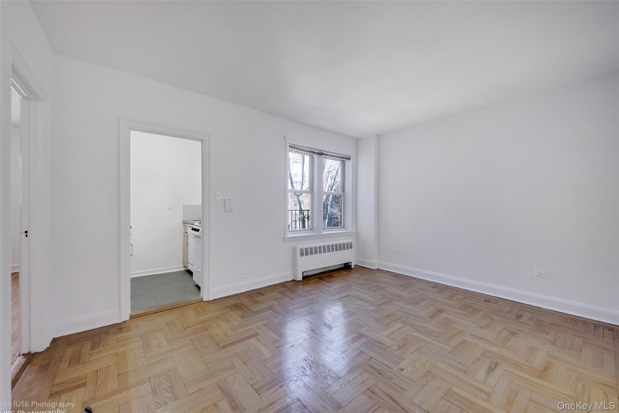 48-41 43rd Street, Unit 5F Queens, NY 11377 - Photo 3 of 8 a view of an empty room with a window