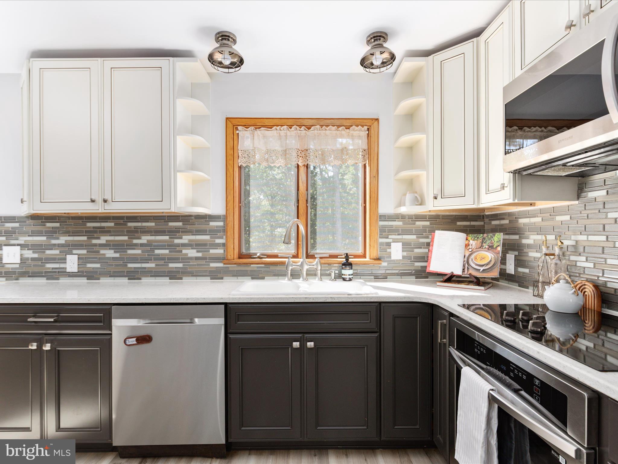 214 Walnut Drive Clear Brook, VA 22624 - Photo 14 of 75 a kitchen with stainless steel appliances granite countertop a sink and a stove