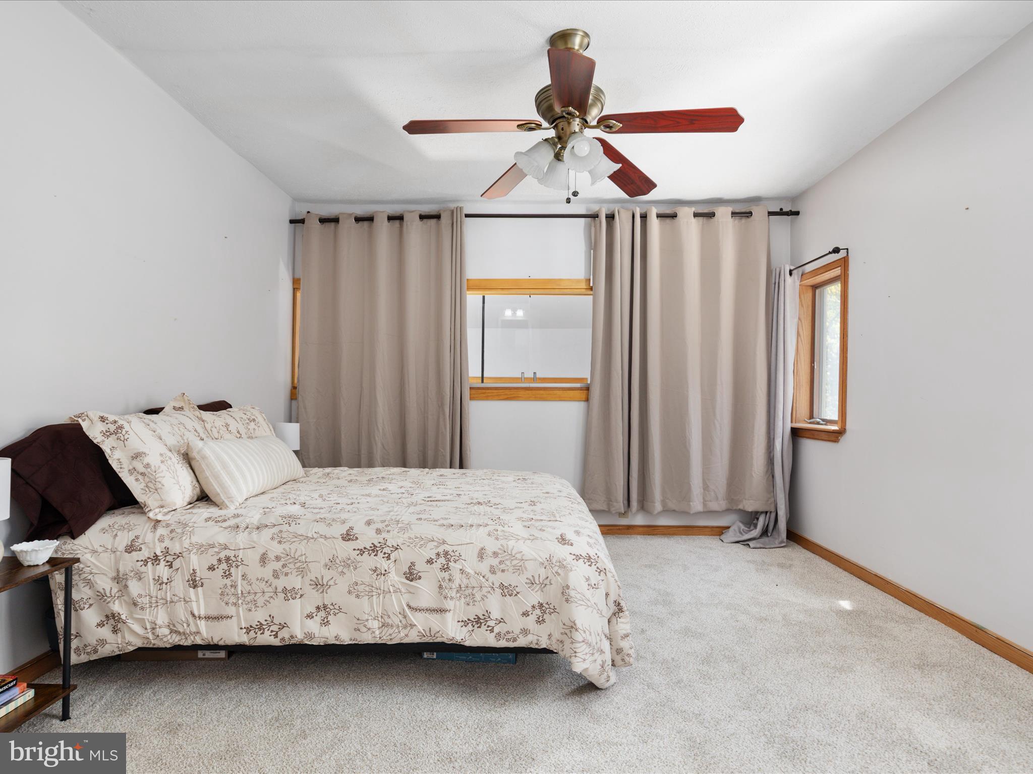214 Walnut Drive Clear Brook, VA 22624 - Photo 20 of 75 a bedroom with a bed and a chandelier