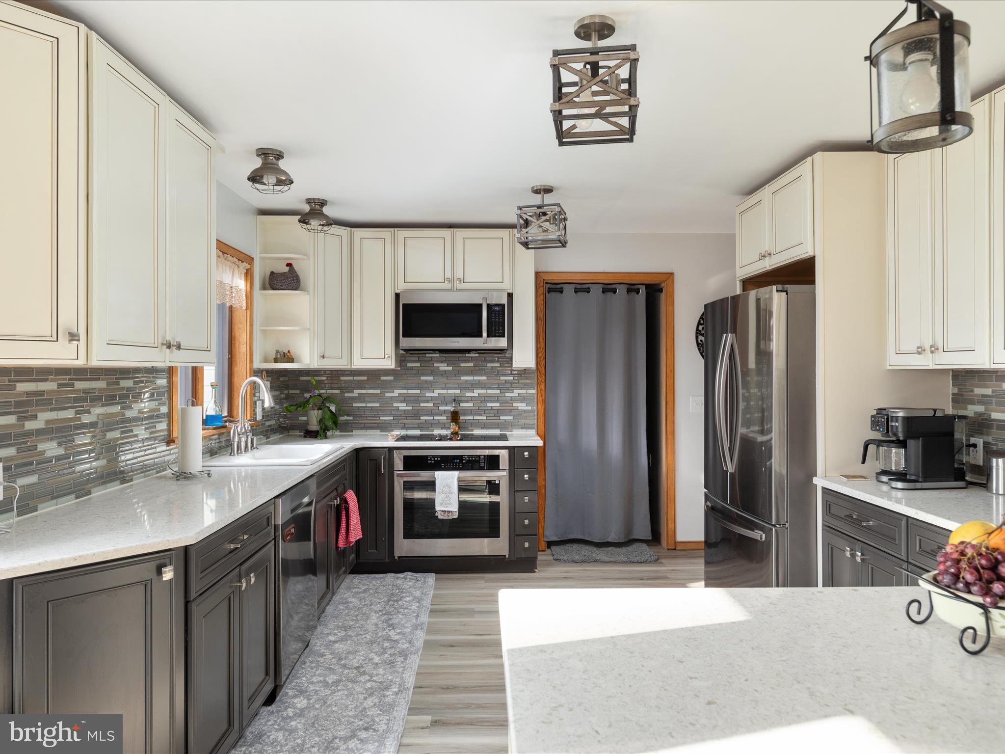 214 Walnut Drive Clear Brook, VA 22624 - Photo 2 of 75 a kitchen with stainless steel appliances granite countertop a refrigerator a stove top oven a sink and dishwasher
