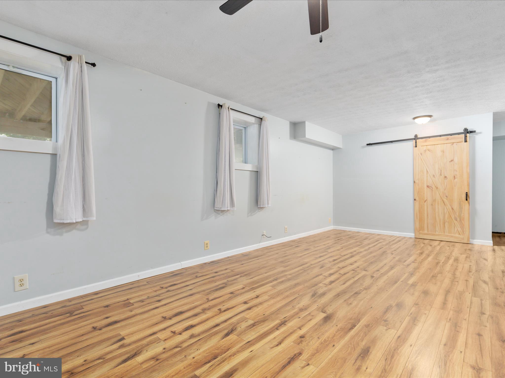 214 Walnut Drive Clear Brook, VA 22624 - Photo 35 of 75 a view of empty room with wooden floor and fan