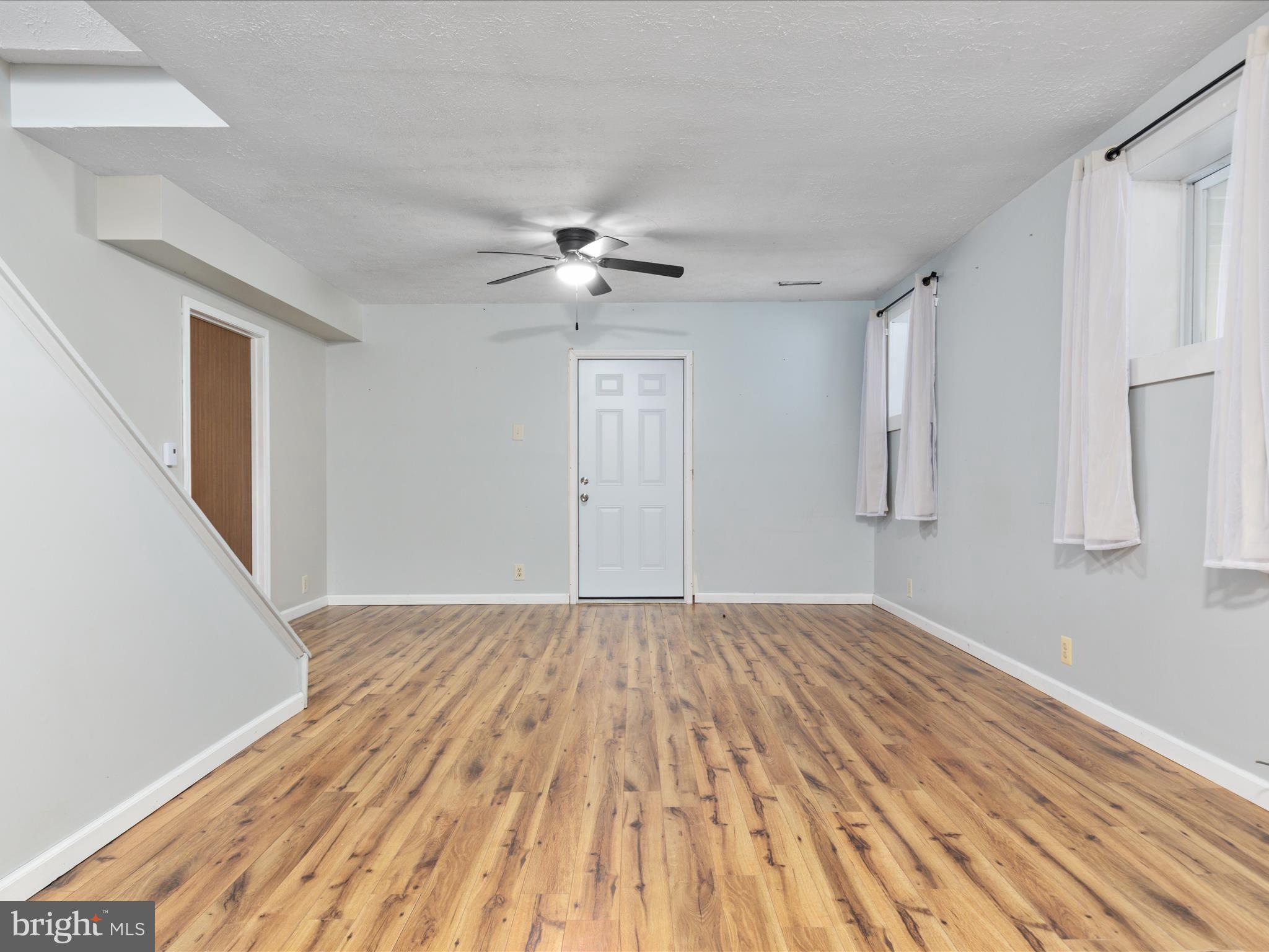 214 Walnut Drive Clear Brook, VA 22624 - Photo 37 of 75 a view of empty room with wooden floor and fan