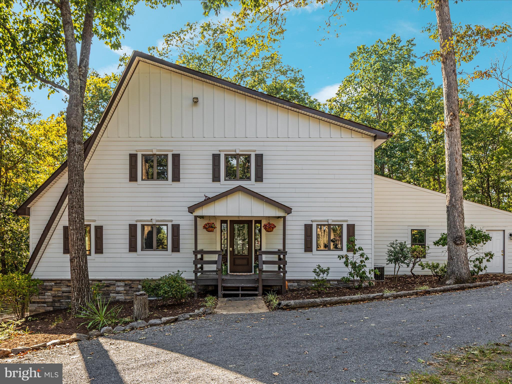 214 Walnut Drive Clear Brook, VA 22624 - Photo 63 of 75 a front view of a house with yard and trees
