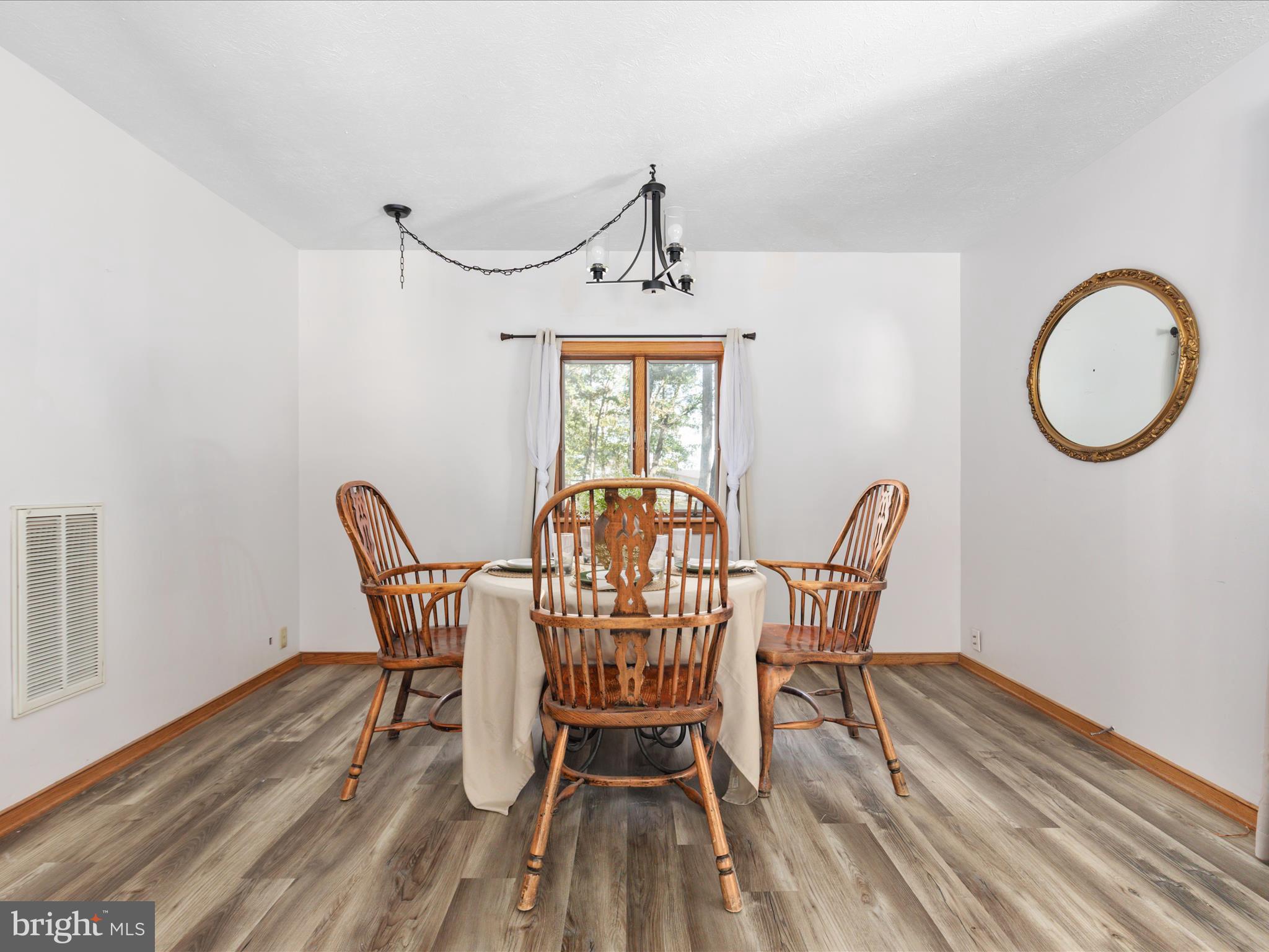 214 Walnut Drive Clear Brook, VA 22624 - Photo 7 of 75 a view of a dining room with furniture window and wooden floor