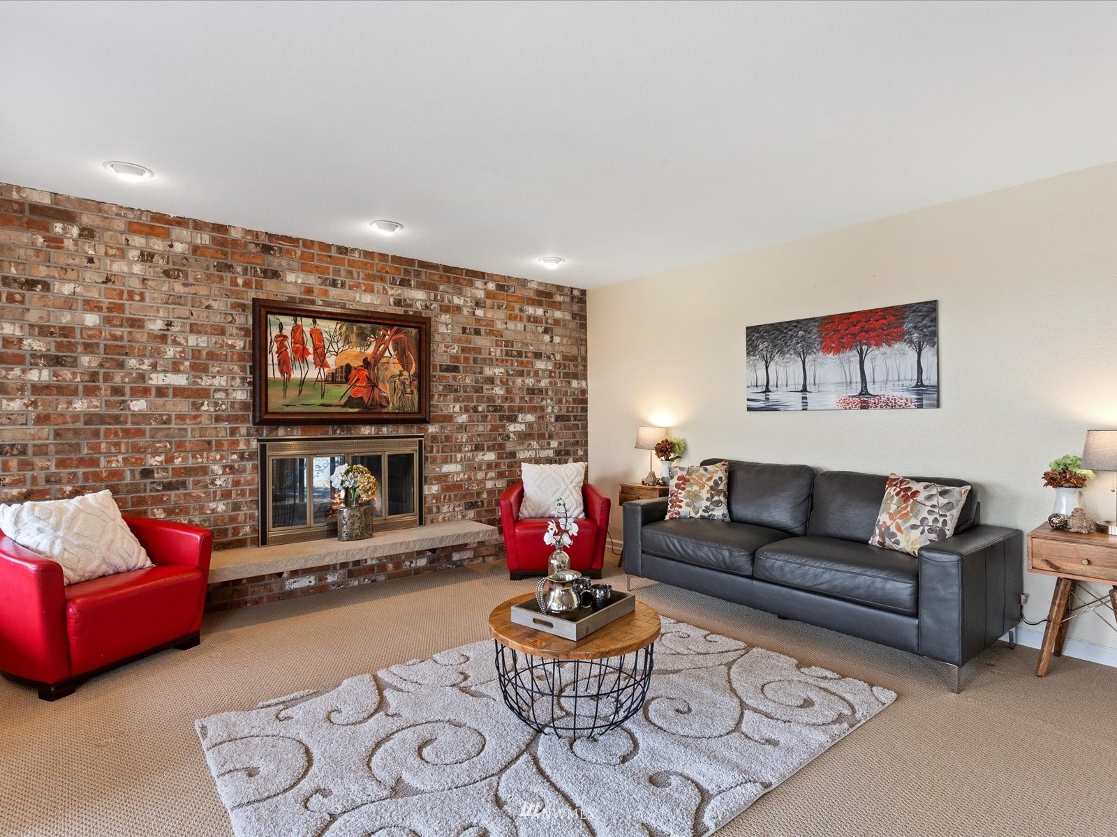 18156 Riviera Place Southwest Normandy Park, WA 98166 - Photo 22 of 40 a living room with furniture fireplace and a flat screen tv