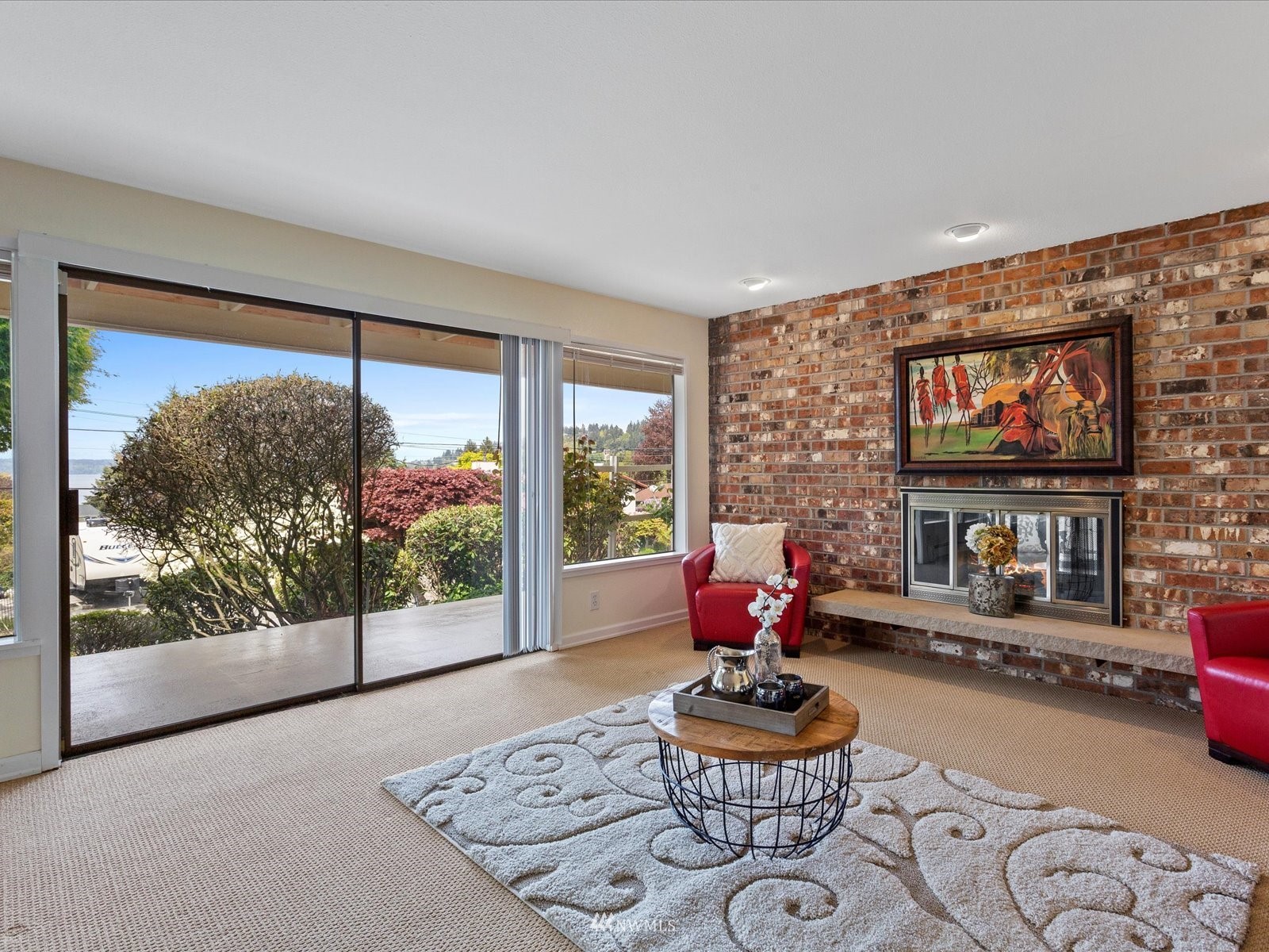 18156 Riviera Place Southwest Normandy Park, WA 98166 - Photo 23 of 40 a living room with fireplace furniture and a large window