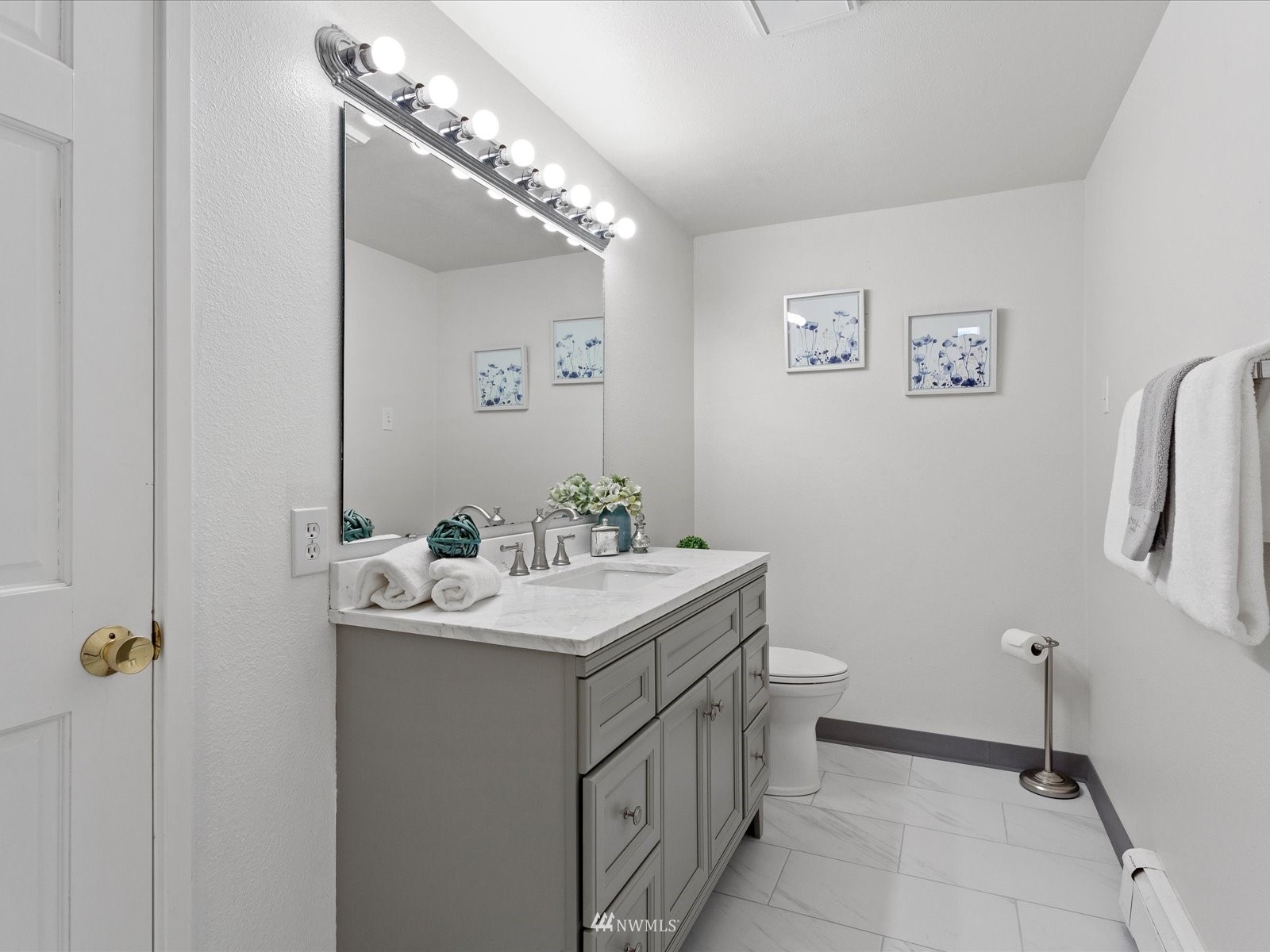 18156 Riviera Place Southwest Normandy Park, WA 98166 - Photo 24 of 40 a bathroom with a sink a toilet and mirror