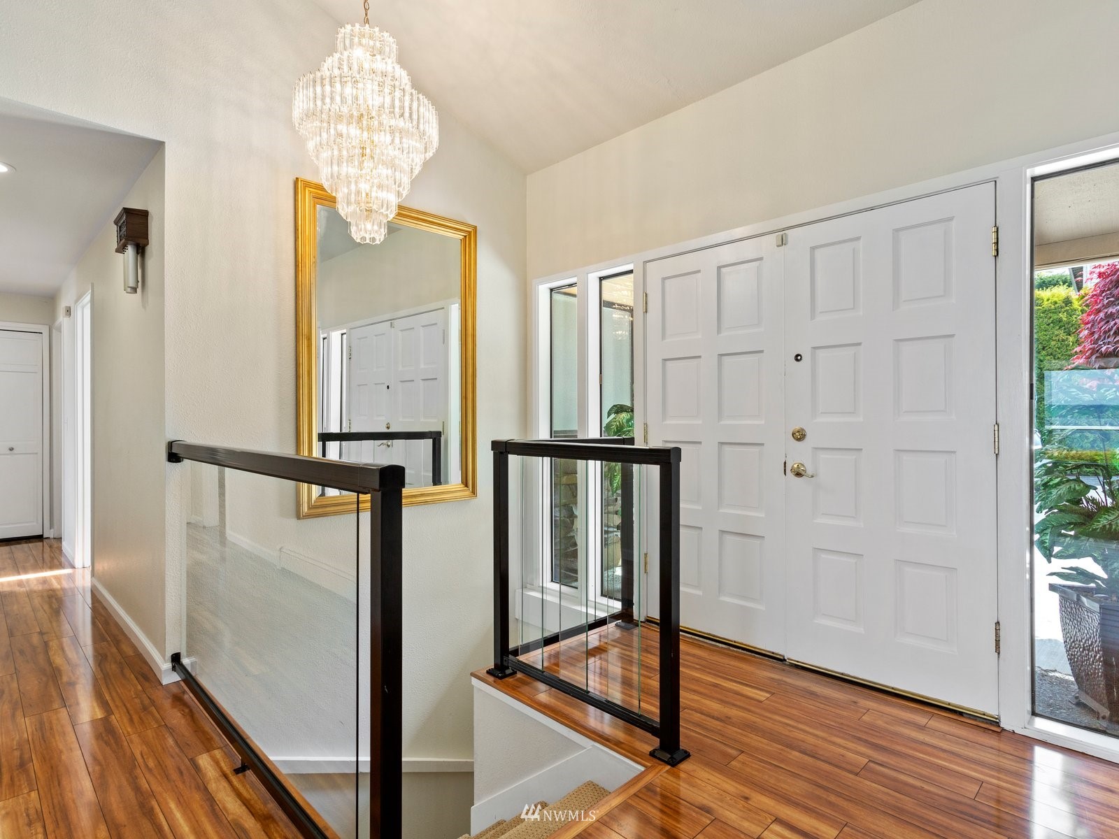 18156 Riviera Place Southwest Normandy Park, WA 98166 - Photo 3 of 40 a view of a hallway with wooden floor and staircase