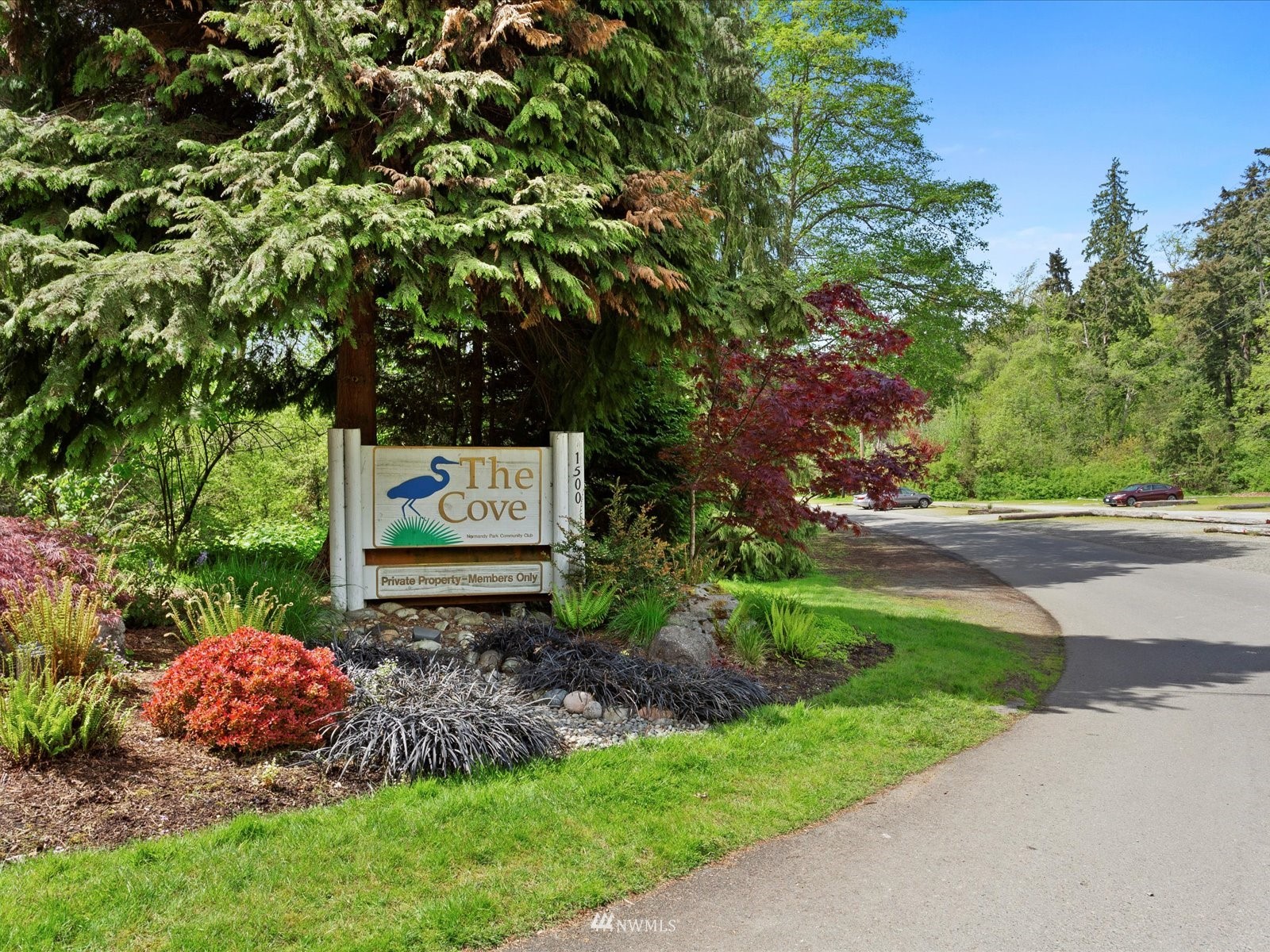 18156 Riviera Place Southwest Normandy Park, WA 98166 - Photo 37 of 40 a sign board with a house in the background
