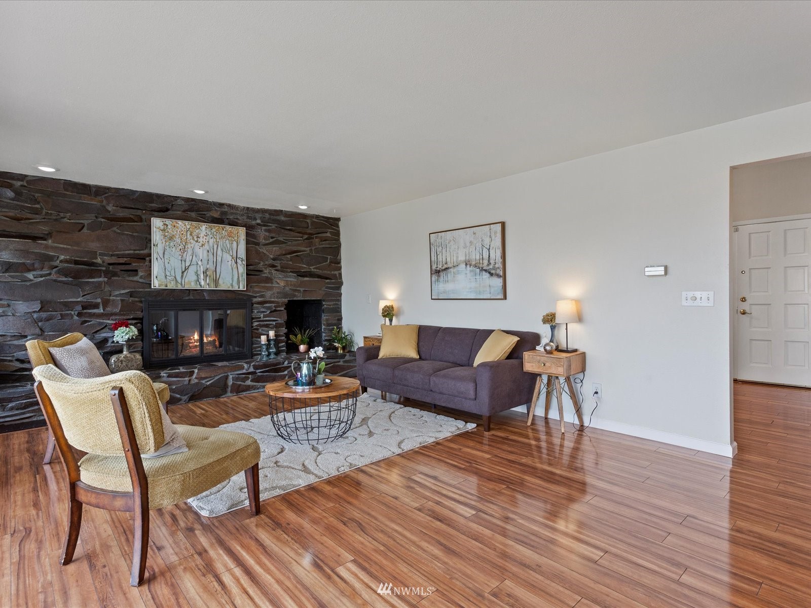 18156 Riviera Place Southwest Normandy Park, WA 98166 - Photo 4 of 40 a living room with fireplace furniture and a wooden floor