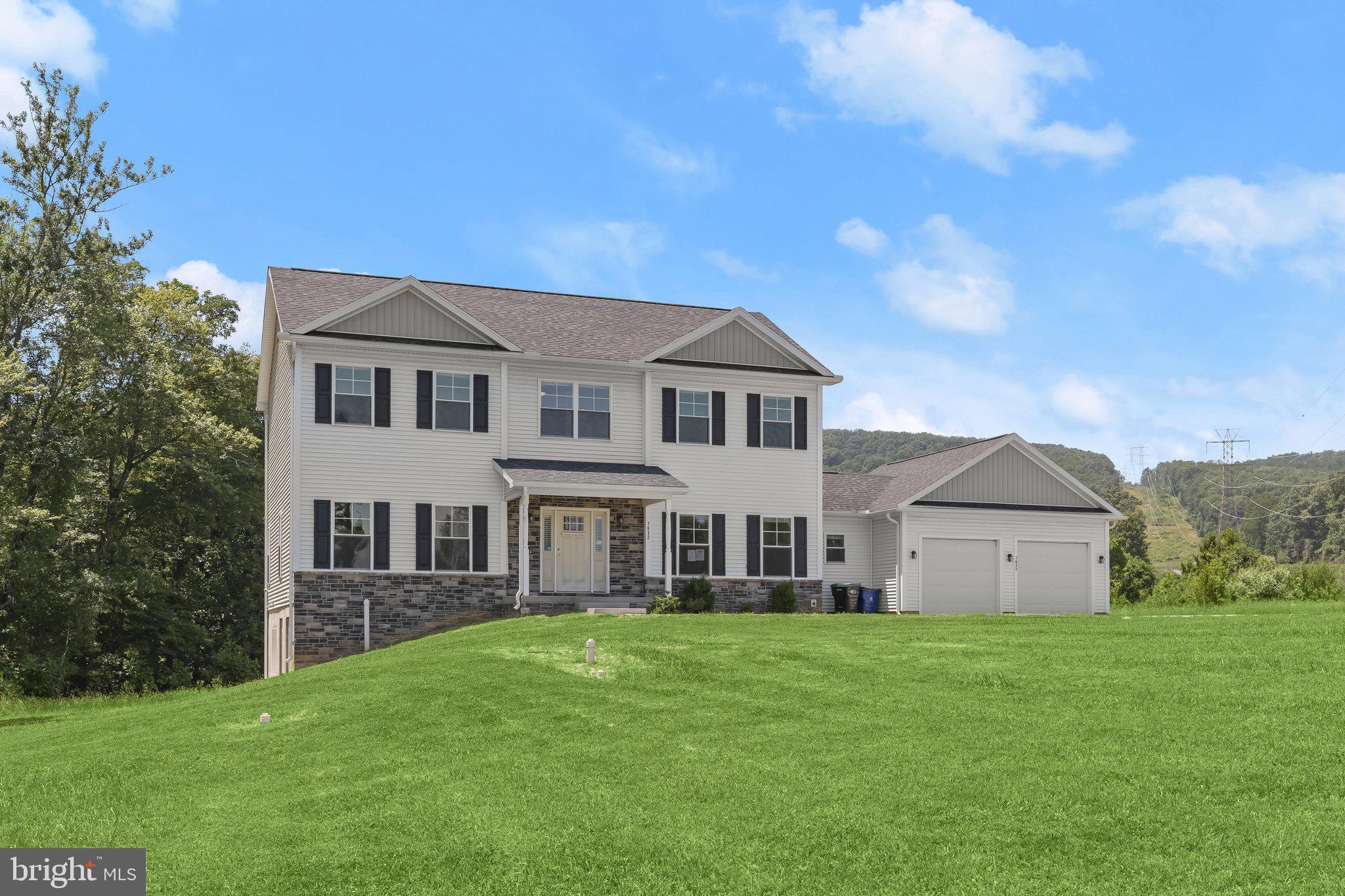 7832 Old Receiver Road Frederick, MD 21702 - Photo 48 of 57 a front view of a house with a garden and yard