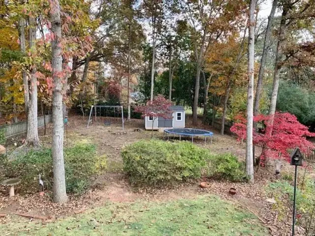 a backyard of a house with outdoor seating