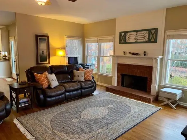 a living room with furniture and a fireplace