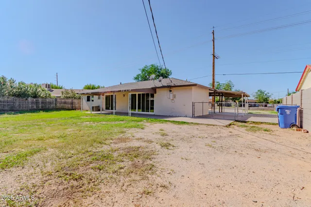 a front view of a house with yard and garage