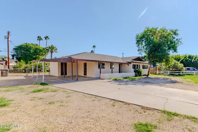 a front view of a house with a yard and a garage