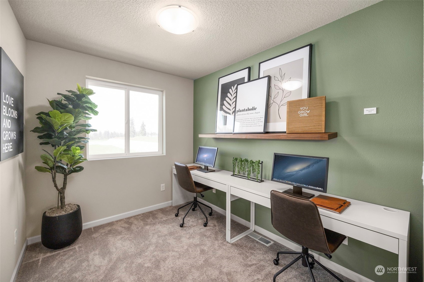 2814 South 9th Avenue Ridgefield, WA 98642 - Photo 20 of 37 a view of a workspace with furniture and a potted plant