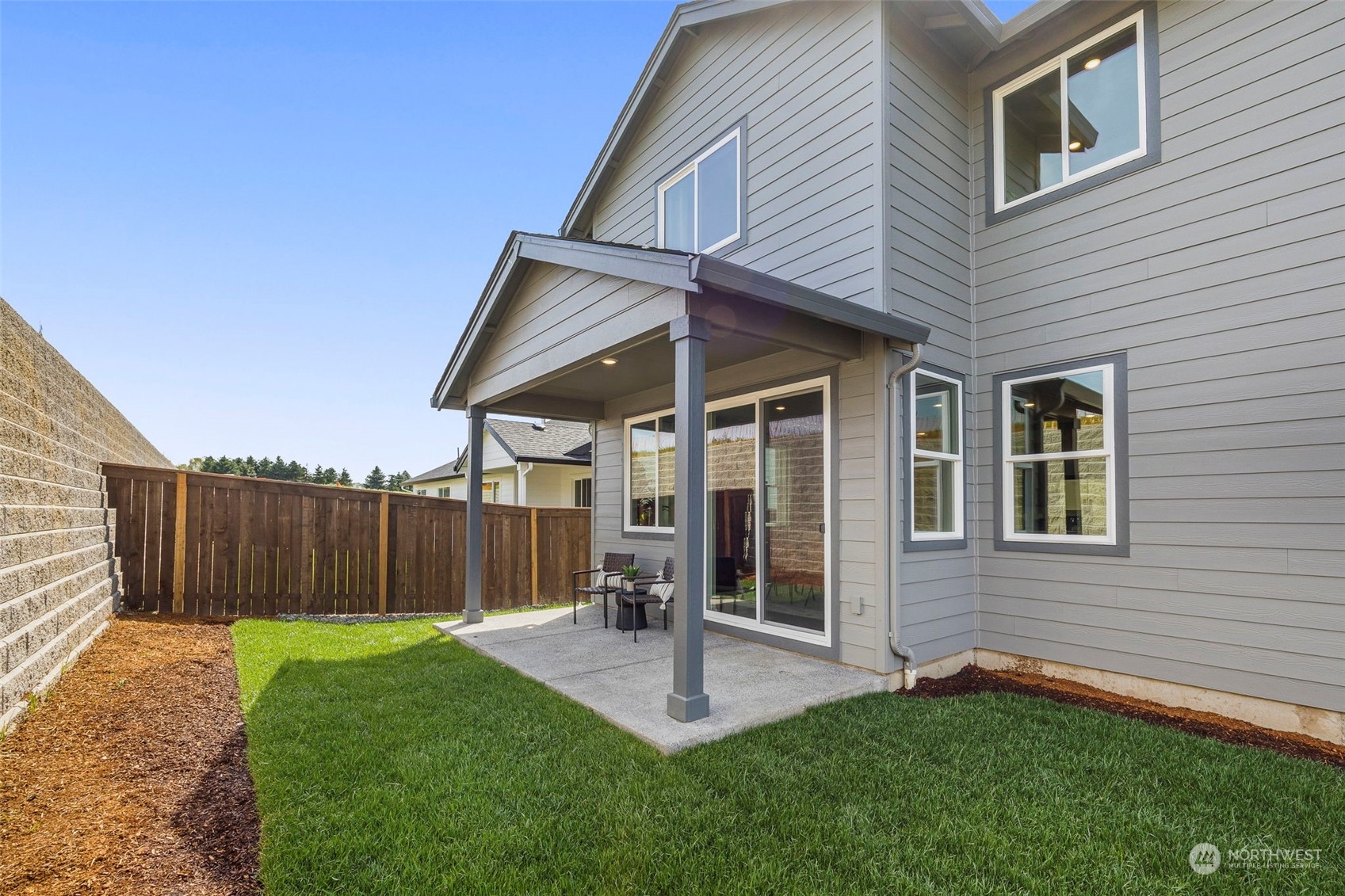 2814 South 9th Avenue Ridgefield, WA 98642 - Photo 25 of 37 a backyard of a house with table and chairs