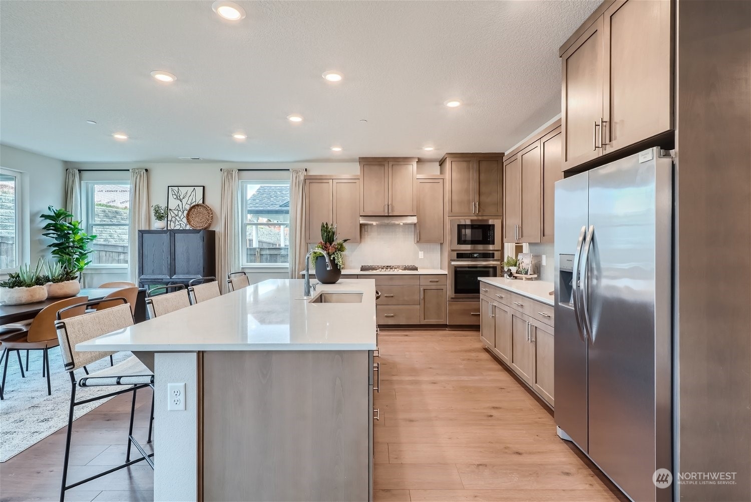 2814 South 9th Avenue Ridgefield, WA 98642 - Photo 27 of 37 a large kitchen with stainless steel appliances lots of counter space and a refrigerator