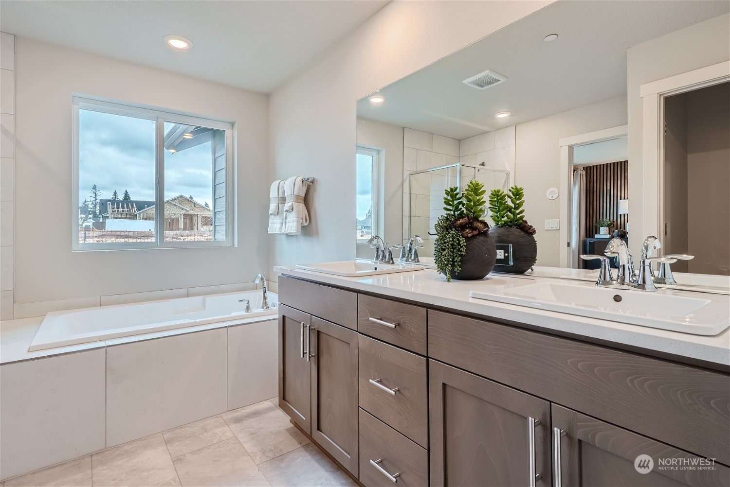2814 South 9th Avenue Ridgefield, WA 98642 - Photo 31 of 37 a bathroom with a sink double vanity granite tub shower and a mirror