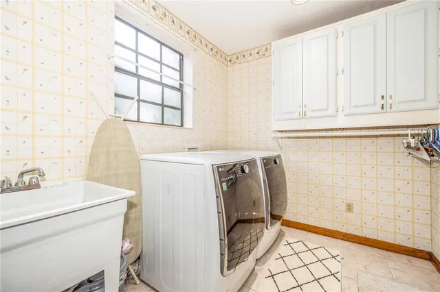 a utility room with dryer and washer