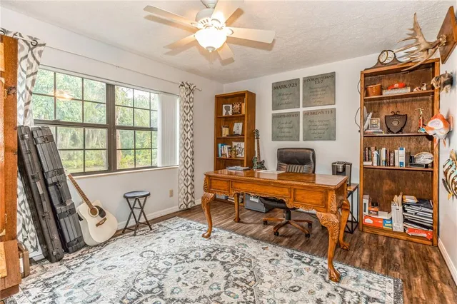 a living room filled with furniture and a window