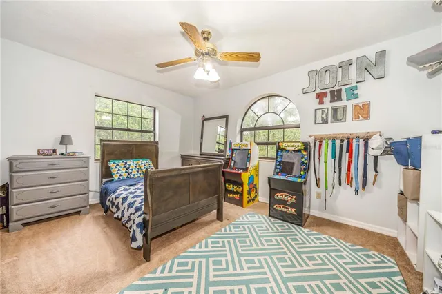 a bedroom with furniture and a window