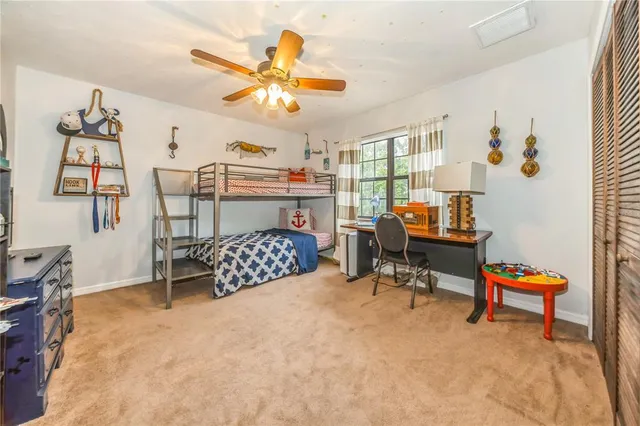 a bedroom with furniture and a chandelier