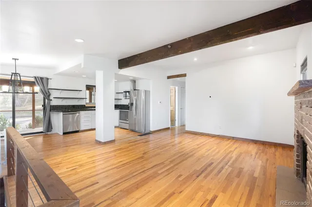 a view of kitchen with wooden floor