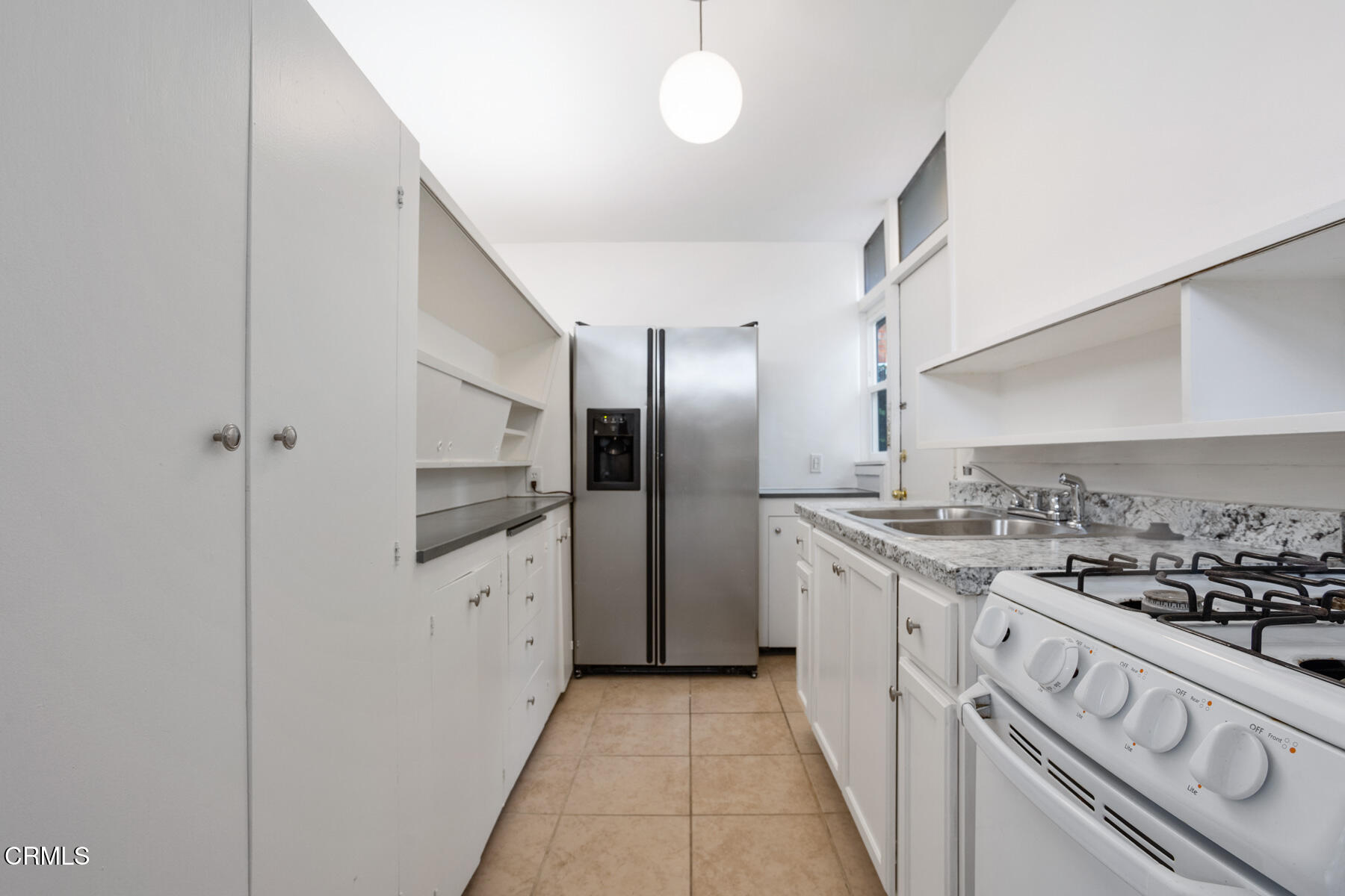 54 Avenue 64 Pasadena, CA 91105 - Photo 13 of 24 a kitchen with stainless steel appliances granite countertop a stove and a refrigerator