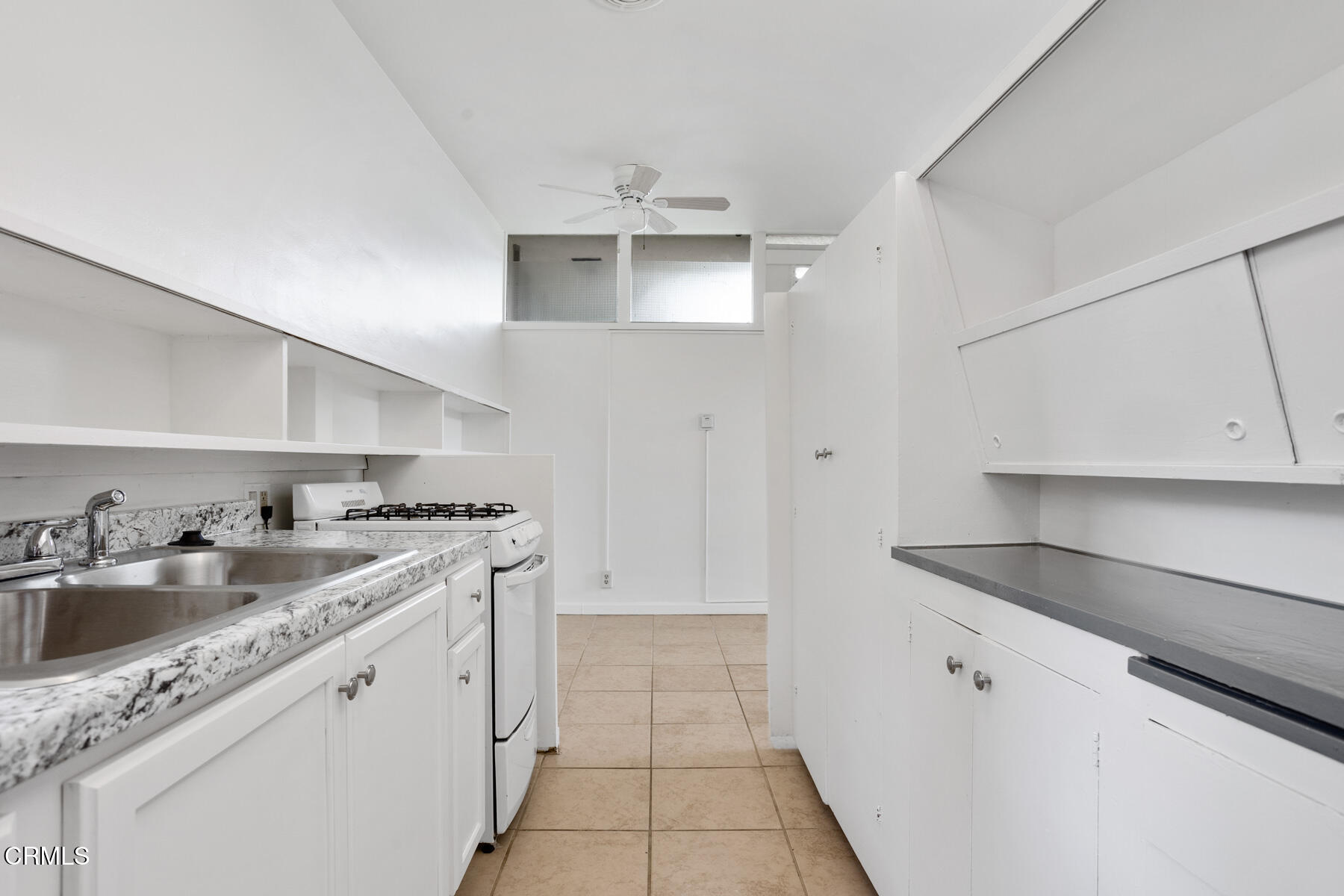 54 Avenue 64 Pasadena, CA 91105 - Photo 17 of 24 a kitchen with stainless steel appliances granite countertop a sink stove and cabinets