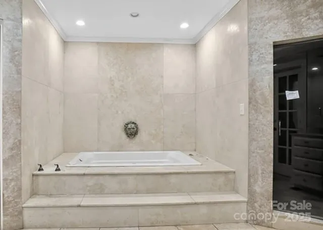a bathroom with a bathtub and shower