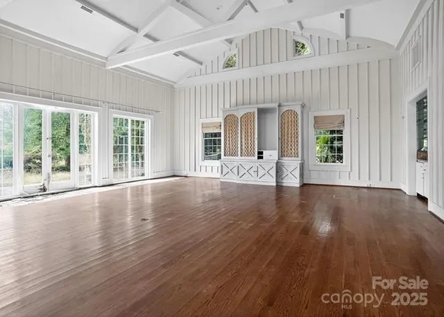 a view of livingroom with furniture wooden floor and windows
