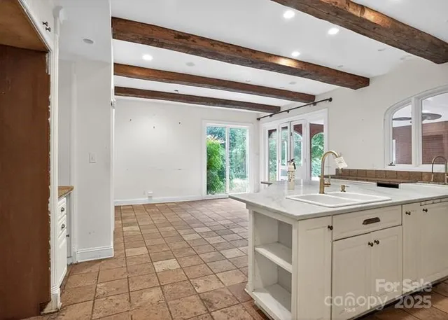a kitchen with a sink and a window