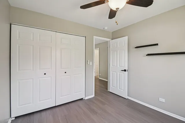 a view of an empty room and wooden floor