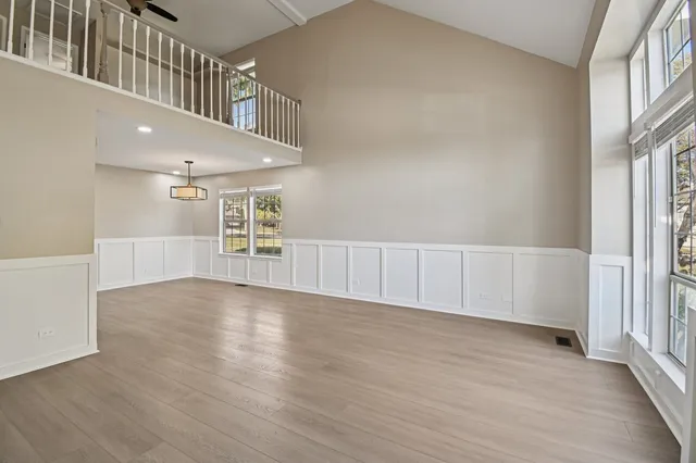 a view of an entryway with wooden floor