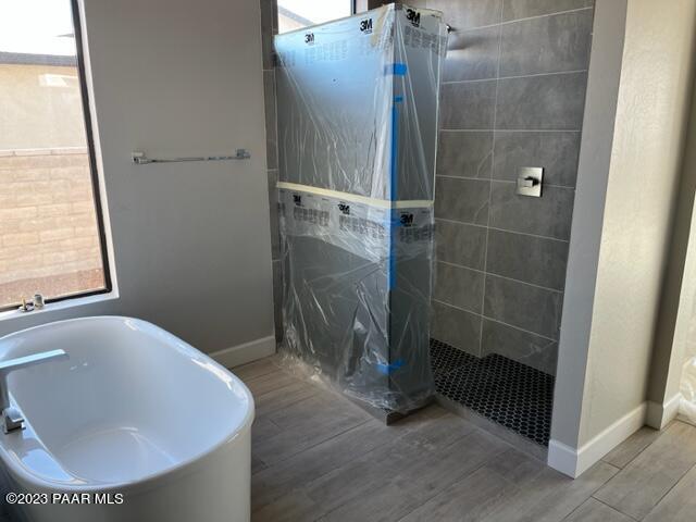 5707 East Killen Loop Prescott Valley, AZ 86314 - Photo 12 of 28 a bathroom with a tub and shower