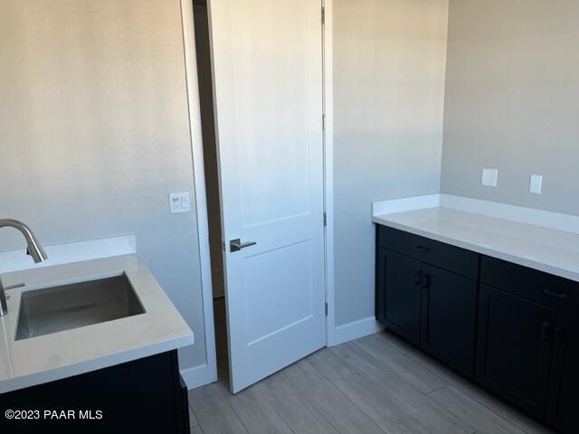 5707 East Killen Loop Prescott Valley, AZ 86314 - Photo 16 of 28 a kitchen with a sink cabinets and wooden floor