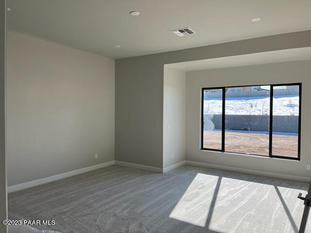 5707 East Killen Loop Prescott Valley, AZ 86314 - Photo 10 of 28 wooden floor in an empty room with a window