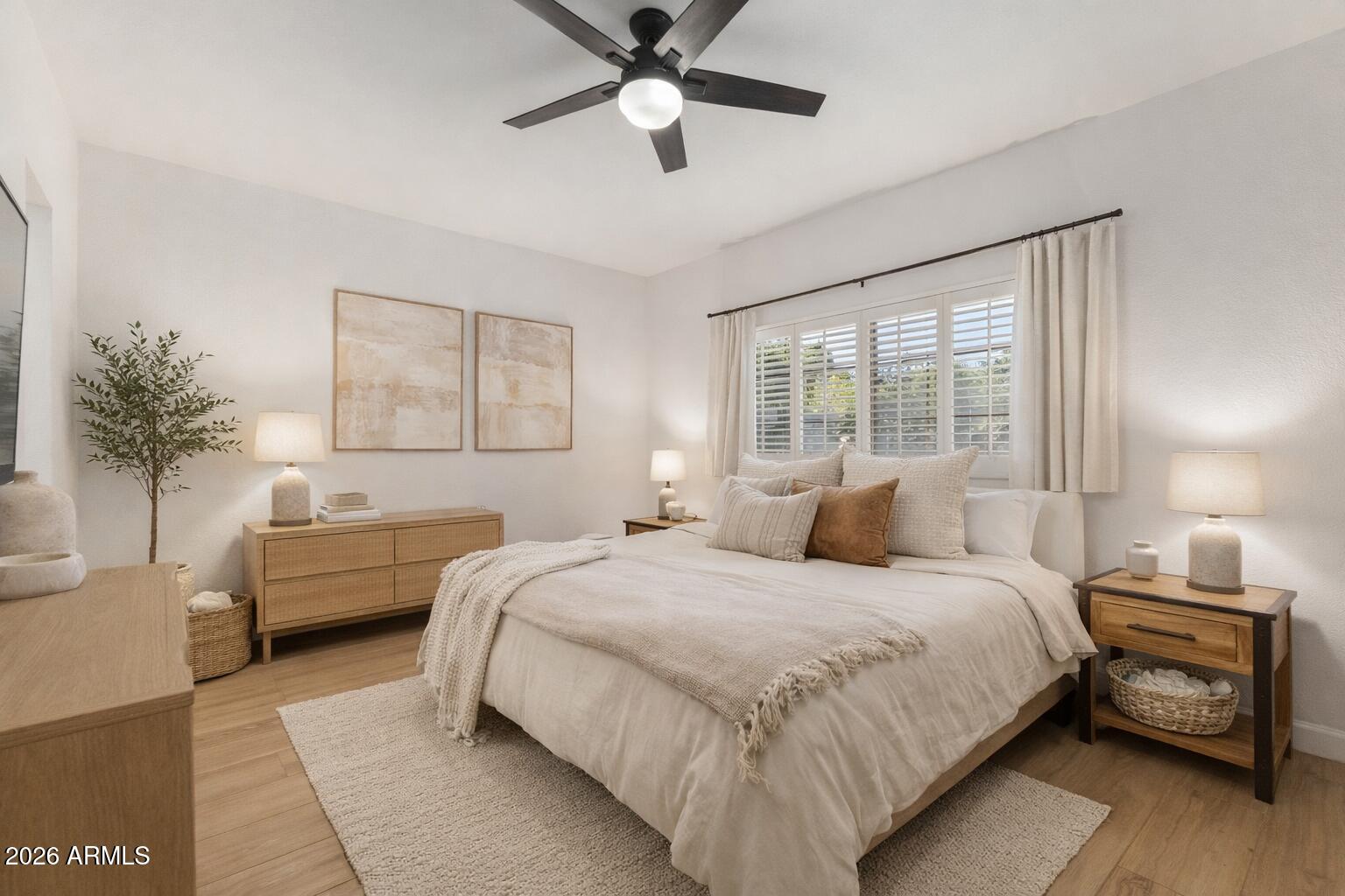 6232 North 30th Place Phoenix, AZ 85016 - Photo 6 of 23 a bedroom with a bed and a chandelier