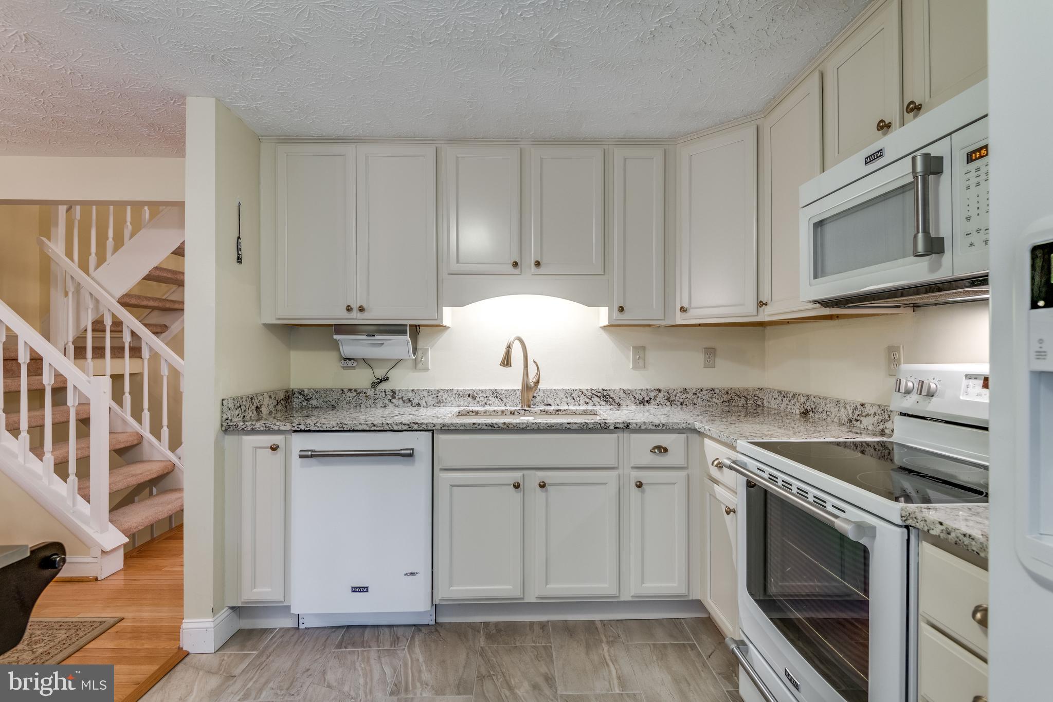 1600 Barnstead Drive Reston, VA 20194 - Photo 9 of 37 Maytag appliances and porcelain tile floor