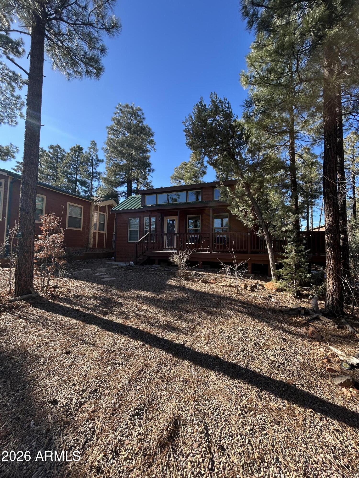 4020 South Elk Trot Loop Show Low, AZ 85901 - Photo 1 of 33 a view of a house with a yard covered in snow