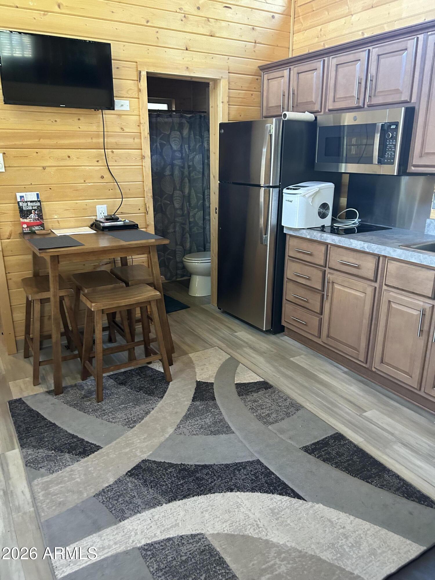4020 South Elk Trot Loop Show Low, AZ 85901 - Photo 20 of 33 a kitchen with stainless steel appliances kitchen island granite countertop a refrigerator stove and oven