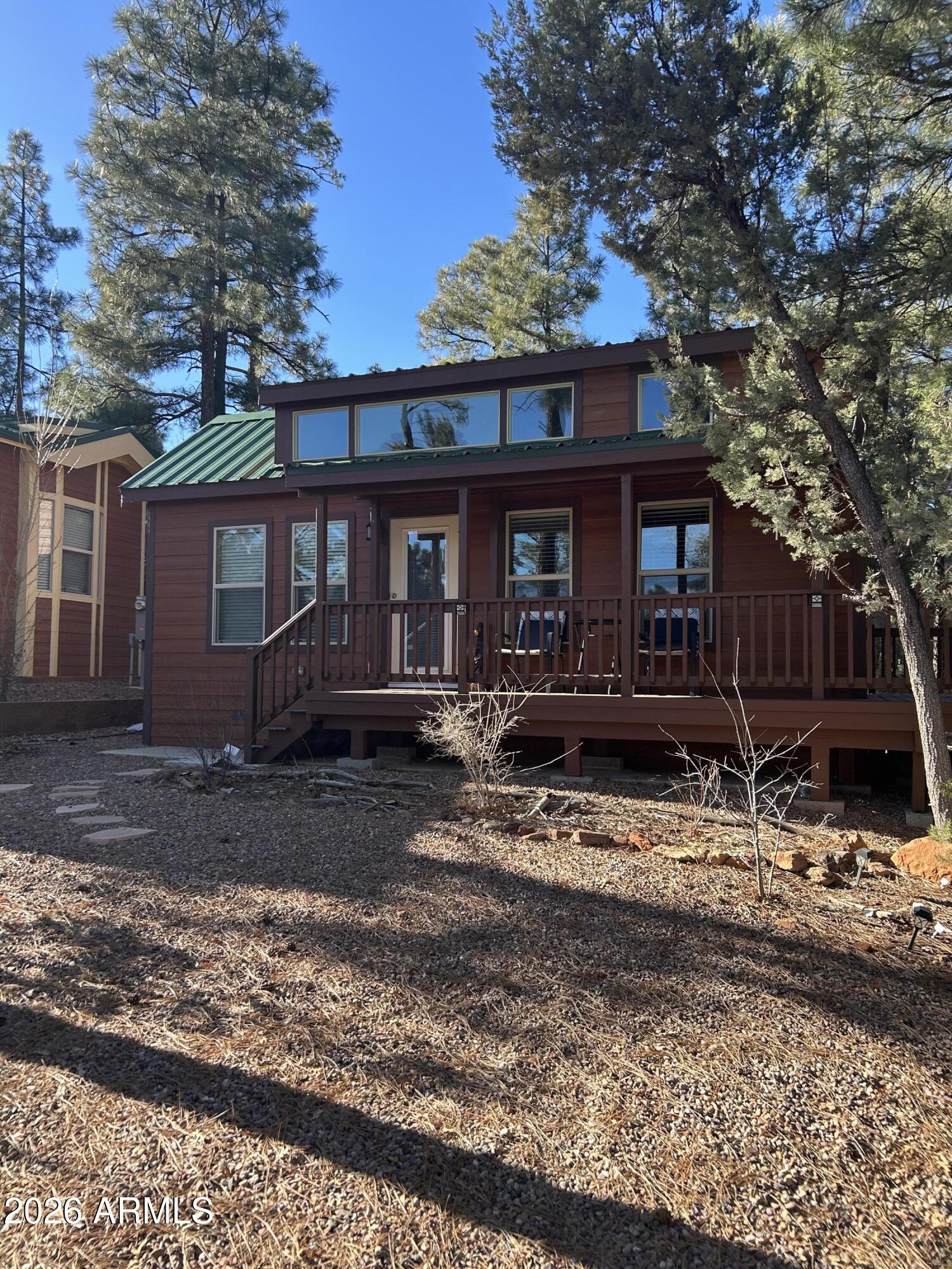 4020 South Elk Trot Loop Show Low, AZ 85901 - Photo 2 of 33 a view of a house with a yard covered with snow