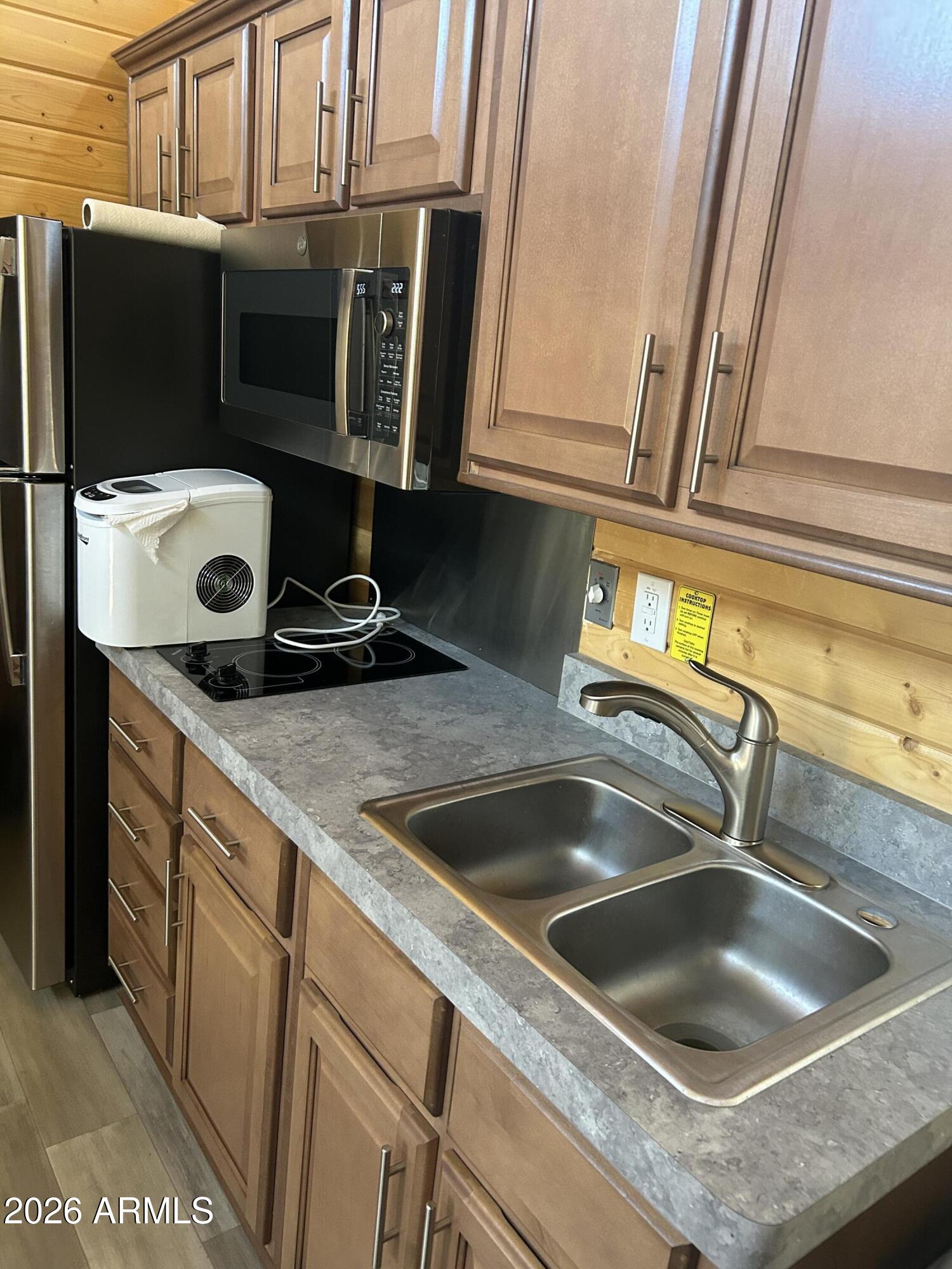4020 South Elk Trot Loop Show Low, AZ 85901 - Photo 21 of 33 a kitchen with a sink and refrigerator