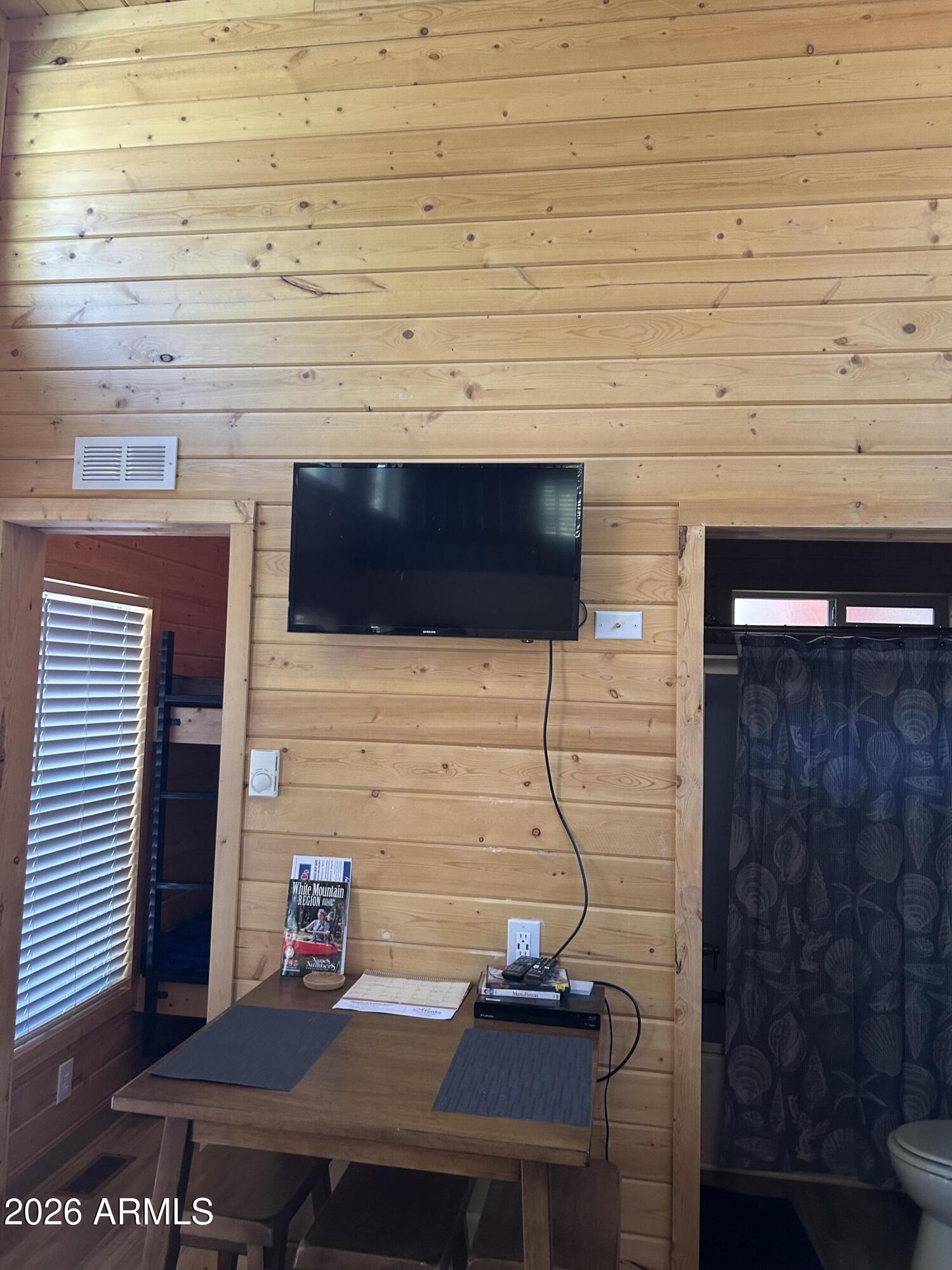 4020 South Elk Trot Loop Show Low, AZ 85901 - Photo 22 of 33 a room with a bench and cabinets