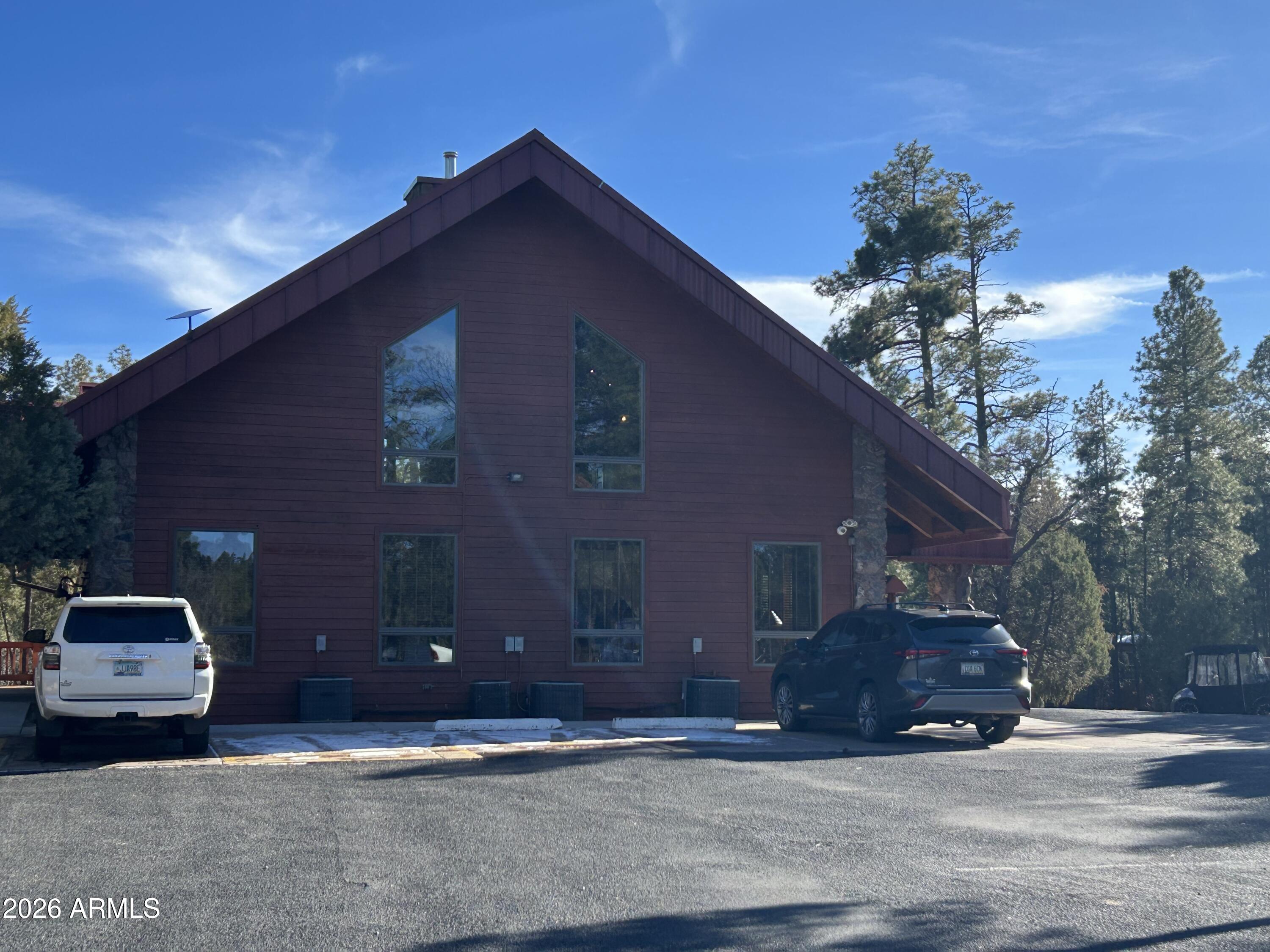 4020 South Elk Trot Loop Show Low, AZ 85901 - Photo 30 of 33 a car parked in front of a house