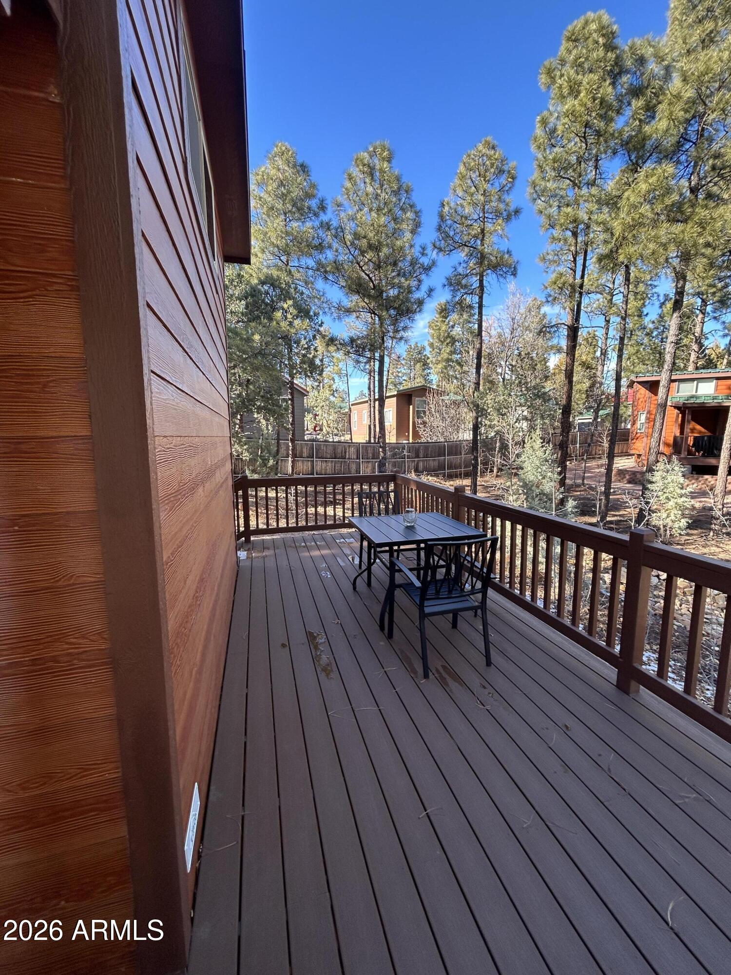 4020 South Elk Trot Loop Show Low, AZ 85901 - Photo 5 of 33 a view of balcony with wooden floor and outdoor seating