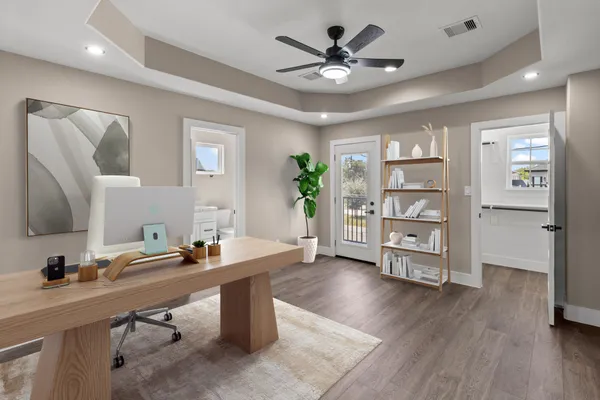 a view of workspace with wooden floor and window